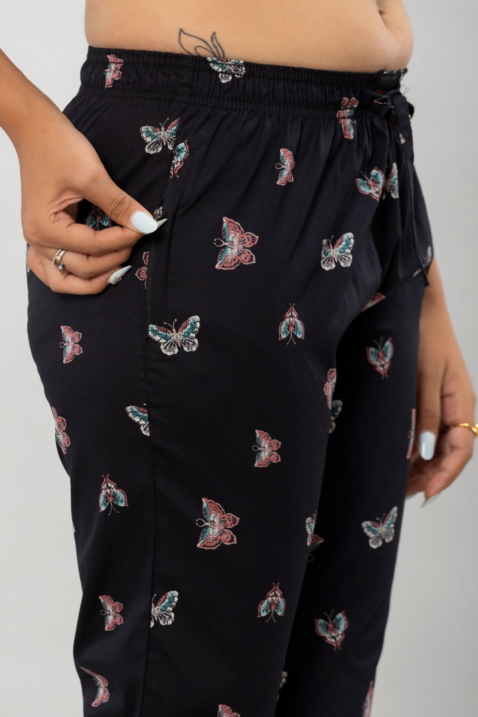 1. "Woman Relaxing in Flamboyant Butterfly Print Pajama
